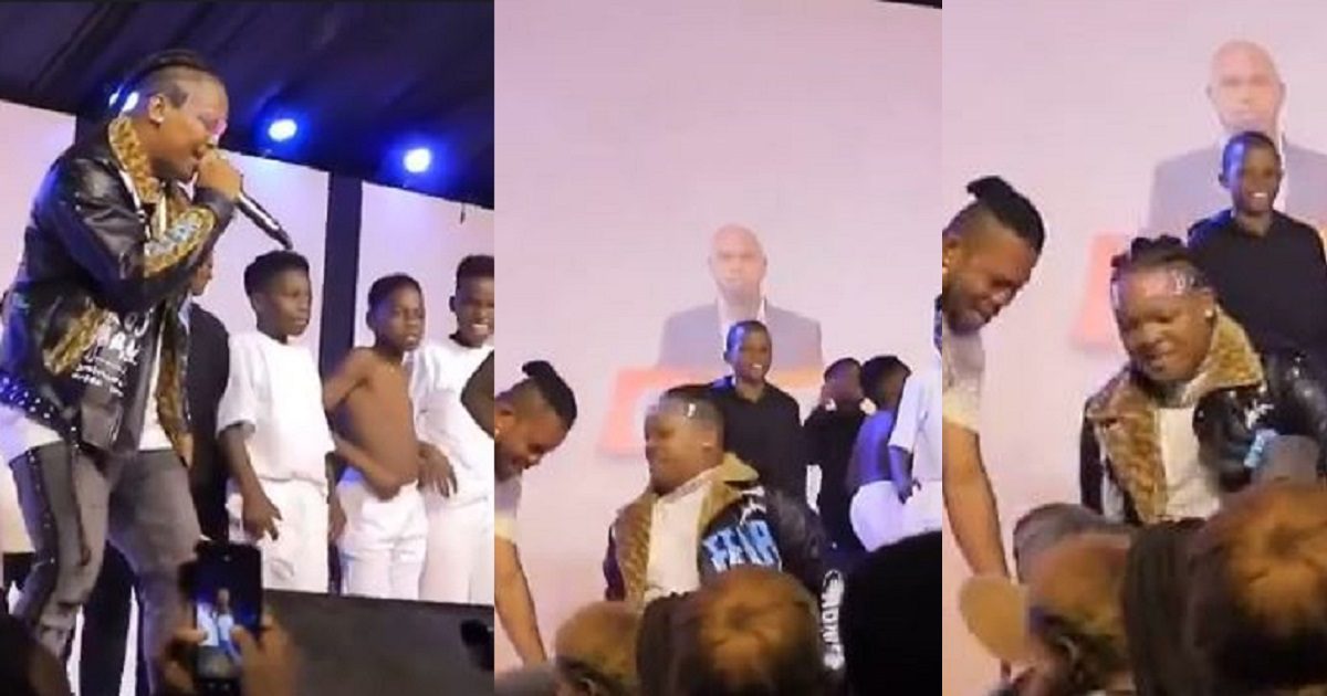 Embarrassing moment singer Eltee Skhillz fell off stage while performing with Ghetto Kids in Uganda (video)